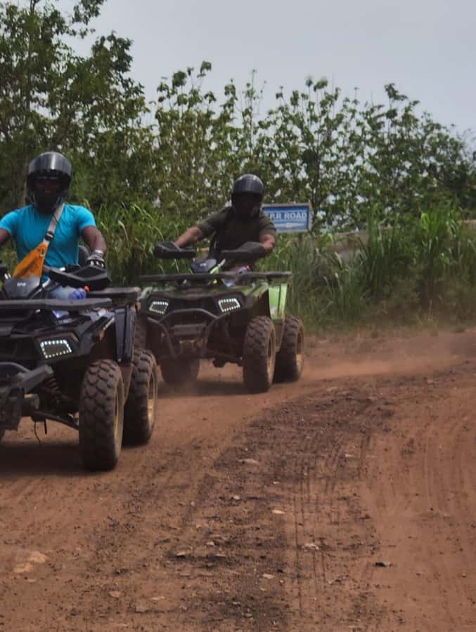 Accra: ATV quad bike, Botanical Garden, & Waterfall Tour - Cooling off beneath the waterfall