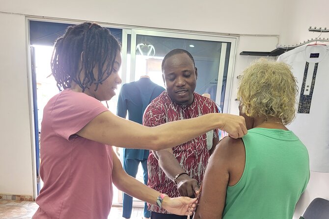 African custom clothing making experience with fabric tour - Taking measurements and shaping the garment